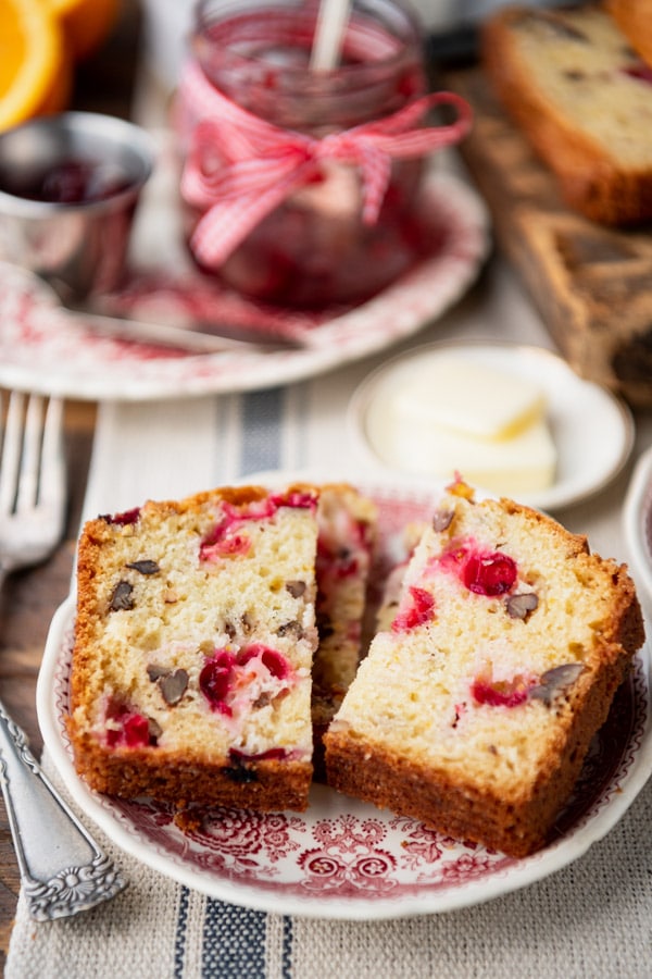 Front shot of a plate of cranberry orange bread on a table