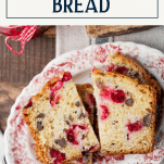 Overhead image of a plate of cranberry bread with text title box at top