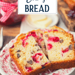 Slices of cranberry nut bread on a plate with text title overlay