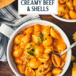 Overhead image of a bowl of creamy beef and shells with text title overlay