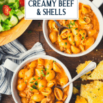 Overhead shot of two bowls of creamy beef and shells with text title overlay