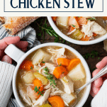 Overhead image of two hands holding a bowl of chicken stew with text title box at top
