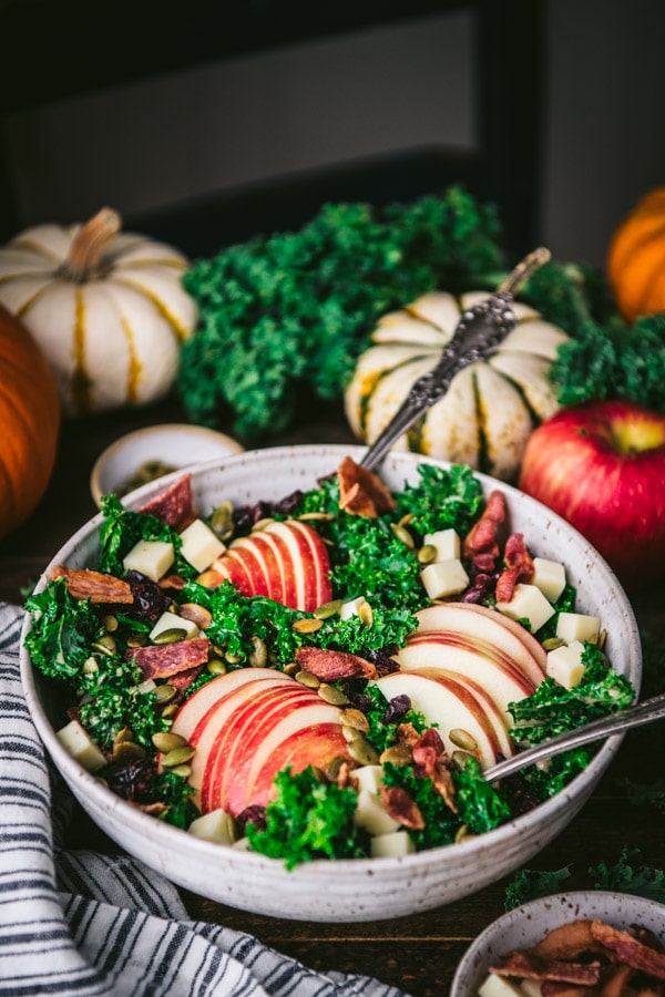 Side shot of a festive fall salad on a Thanksgiving table