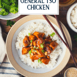 Overhead image of a bowl of baked general tso chicken recipe with rice and text title overlay