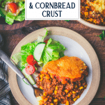 Overhead image of a plate of ground beef cornbread casserole with text title overlay