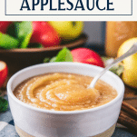 Side shot of a bowl of old fashioned applesauce recipe with text title box at top