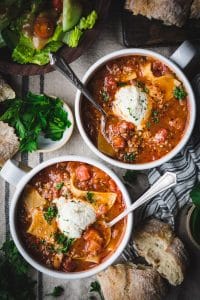Overhead shot of two bowls of slow cooker lasagna soup