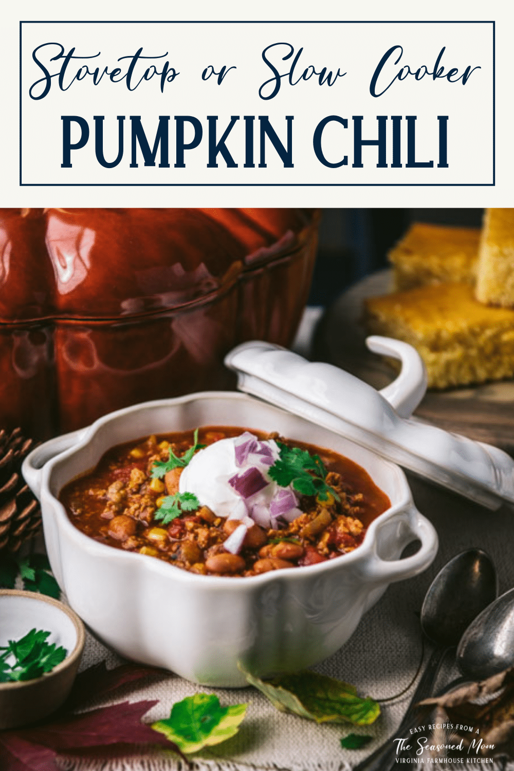 Side shot of turkey pumpkin chili in a bowl on a table with text title box at top