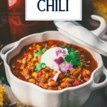 Close up side shot of a bowl of pumpkin chili with text title overlay