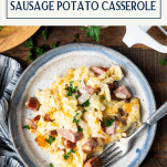 Overhead image of a plate of sausage and potato casserole with text title box at top