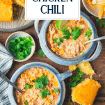 Overhead shot of two bowls of Crockpot chicken chili with text title overlay