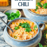 Side shot of a bowl of slow cooker white chicken chili with text title overlay