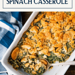 Overhead shot of creamed spinach casserole with text title box at top