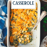 Overhead shot of a pan of spinach casserole with text title overlay