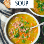 Overhead shot of spoon in a bowl of split pea and ham soup with text title overlay