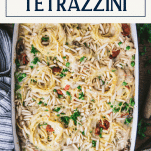 Close overhead image of a pan of turkey tetrazzini with text title box at top