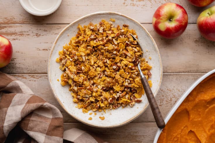 Stirring together the pecan and cornflake topping.
