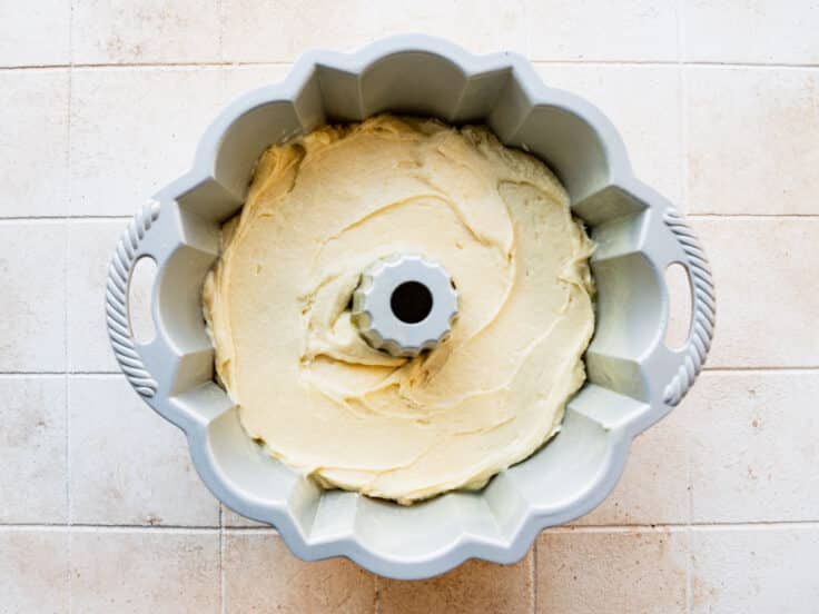 Vanilla pound cake batter in a Bundt pan before baking.