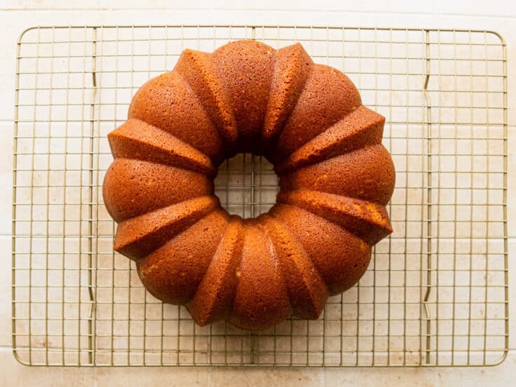 Vanilla pound cake cooling on a wire rack.