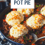 Close up side shot of beef pot pie with text title overlay.