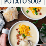 Overhead image of a bowl of crockpot baked potato soup with text title box at top.