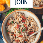 Overhead image of a bowl of hoppin john with text title overlay.