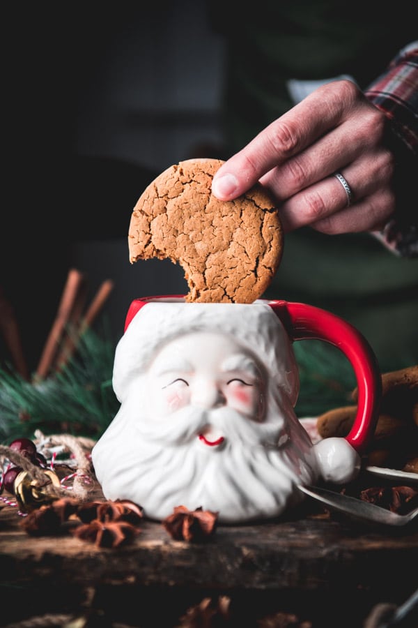 Dipping an old fashioned Williamsburg gingerbread cookie in a Santa mug.