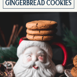 Stack of gingerbread cookies on a Santa mug with text title box at top.
