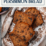 Overhead image of a tray of easy persimmon bread recipe with text title box at top