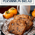 Side shot of a tray of james beard persimmon bread recipe with text title box at top