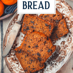 Overhead shot of a tray of persimmon bread recipe with text title overlay