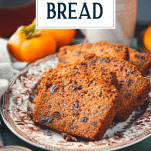 Side shot of a tray of persimmon bread with text title overlay