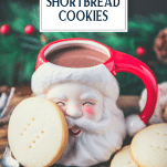 Side shot of shortbread cookies with a Santa mug and text title overlay.