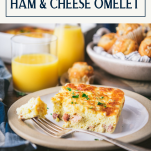 Side shot of a slice of baked ham and cheese omelette with text title box at top.