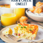 Side shot of a slice of baked ham and cheese omelette with text title overlay