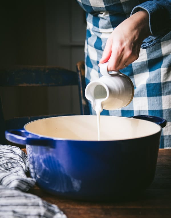 Pouring buttermilk into a pot.