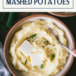Overhead shot of a bowl of buttermilk mashed potatoes with text title box at top.