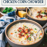 Side shot of a spoon in a bowl of slow cooker chicken corn chowder with text title overlay