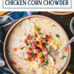 Spoon in a bowl of the best chicken corn chowder recipe with text title box at top