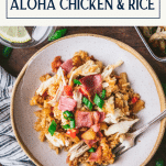 Overhead shot of a bowl of aloha chicken and rice with text title box at top