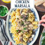 Overhead shot of hands serving chicken marsala with text title overlay