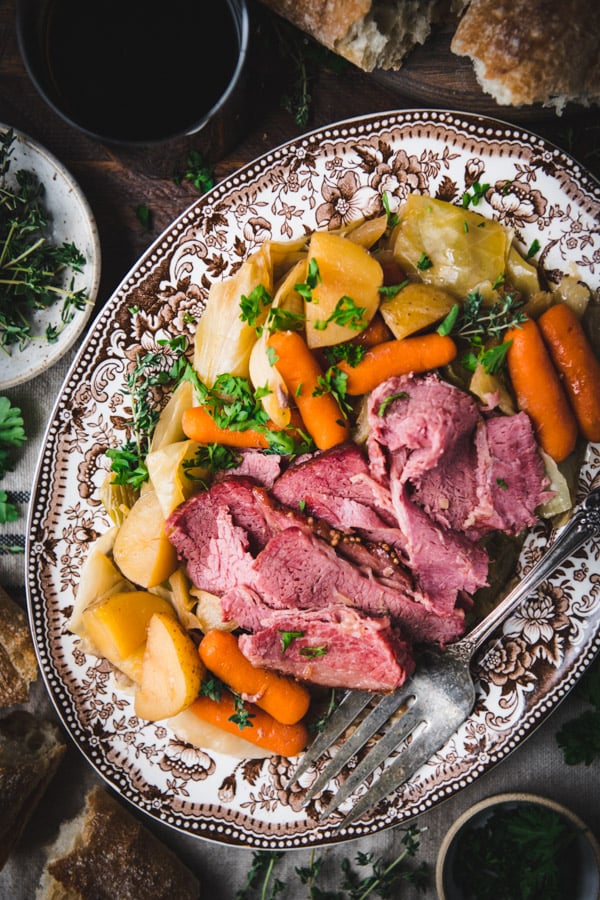 Close overhead image of corned beef and cabbage on a platter