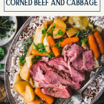 Close overhead shot of a tray of corned beef and cabbage with text title box at top.
