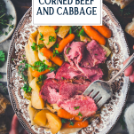 Overhead shot of hands serving a tray of corned beef and cabbage with text title overlay