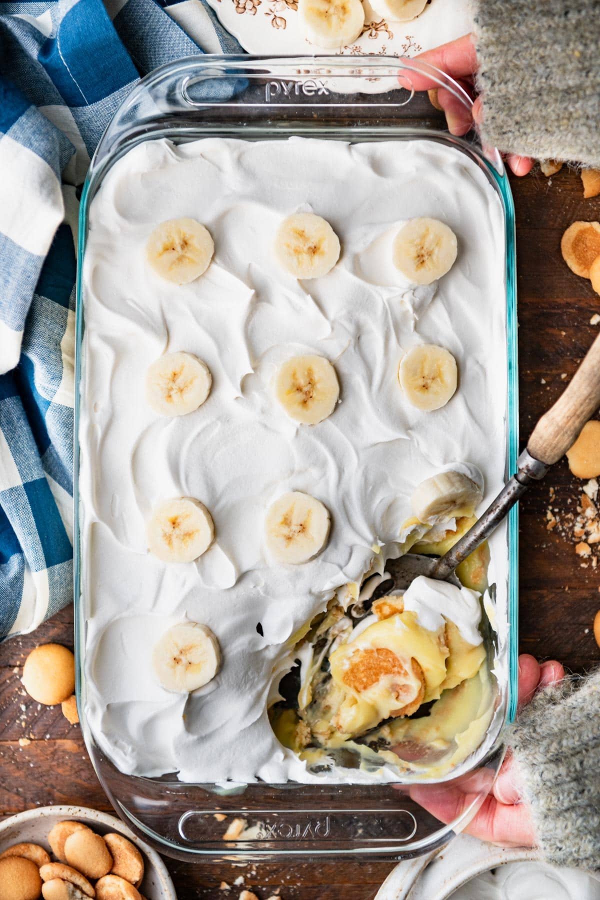 Vintage spoon in a glass dish full of the best banana pudding recipe.