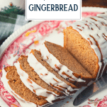 Close up side shot of a sliced gingerbread loaf with text title overlay