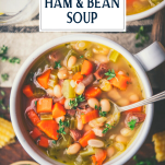 Close overhead shot of navy bean and ham soup with text title overlay