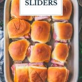 Hot ham and cheese sliders on hawaiian rolls with text title overlay.
