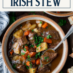 Close overhead shot of a bowl of Irish stew with text title box at top