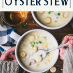 Hands eating a bowl of oyster stew with text title box at top